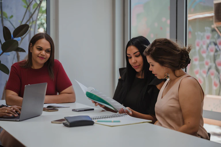 Group of young women collaborating at work