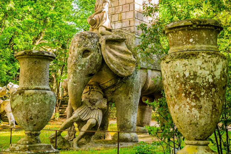 A statue depicts Hannibal on a war elephant and the elephant is sweeping up a Roman soldier with its trunk.