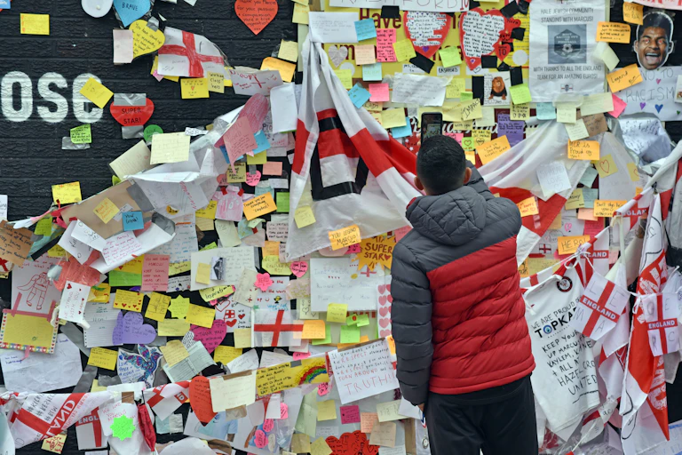 A wall of football tributes and England flags