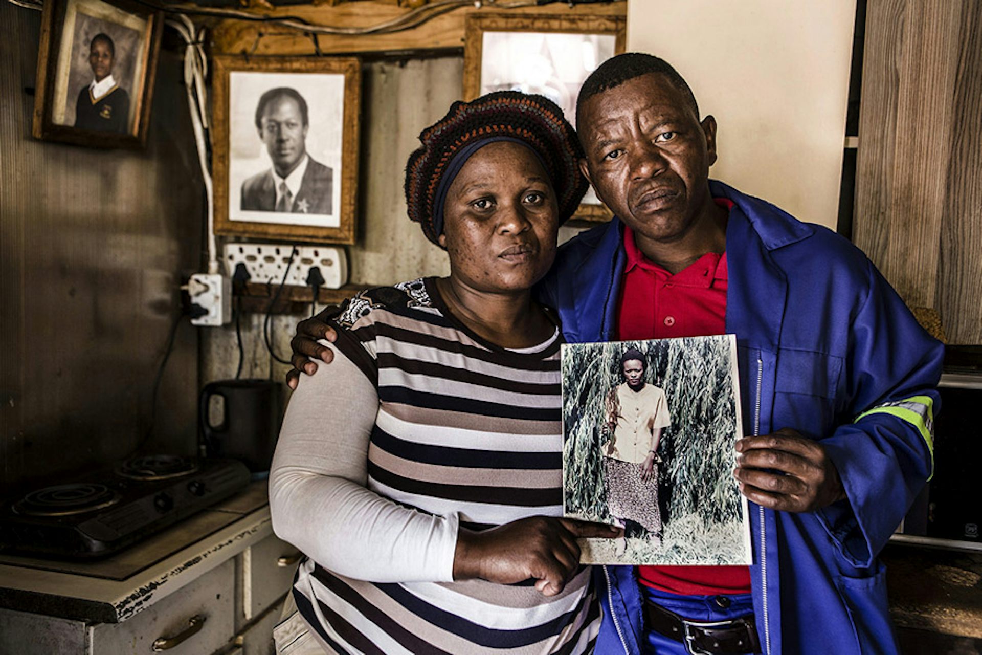 two people holding photograph