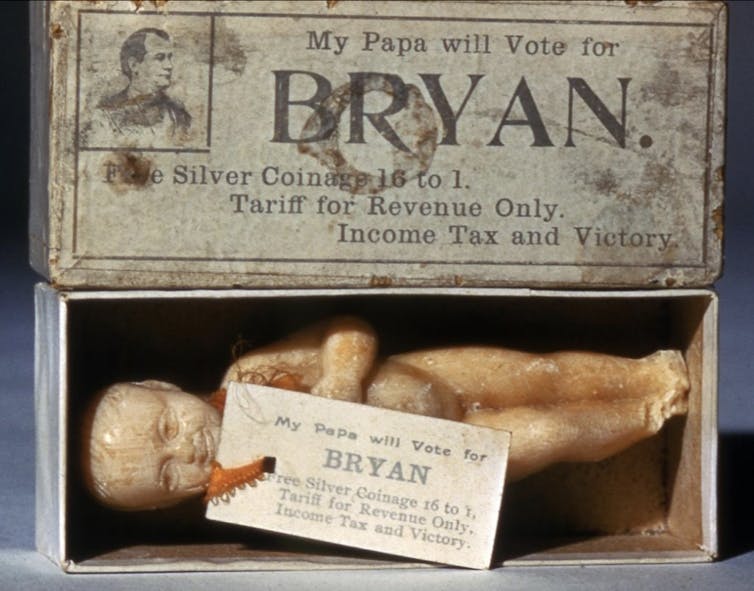 A waxy infant-shaped soap in a box that says 'My Papa will vote for BRYAN.'