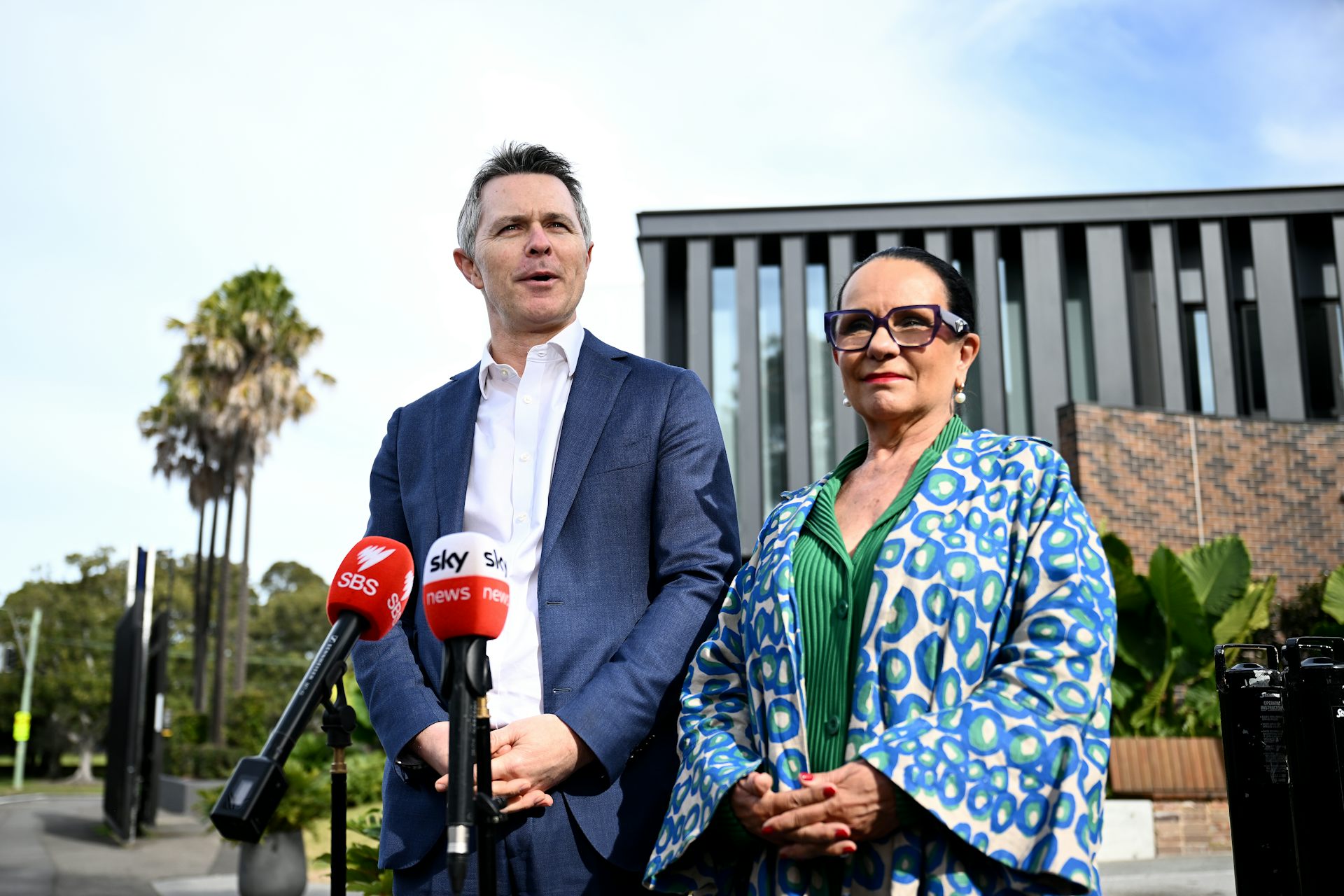 Education Minister Jason Clare and Minister for Indigenous Australians Linda Burney stand in front of microphones.