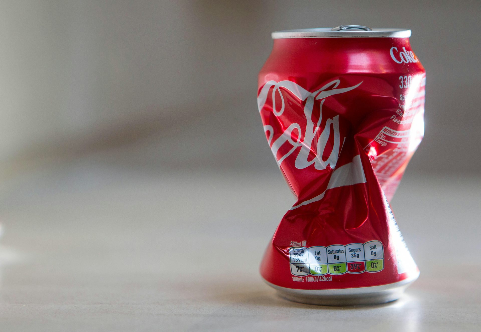 A crushed can of Coca-Cola