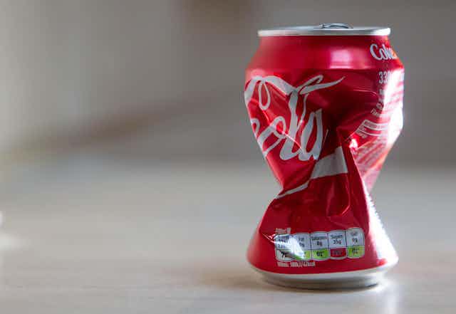 A crushed can of Coca-Cola