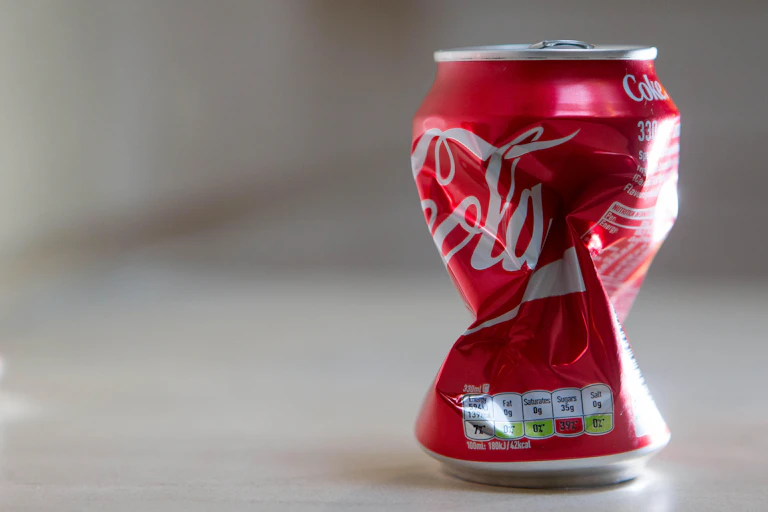 A crushed can of Coca-Cola