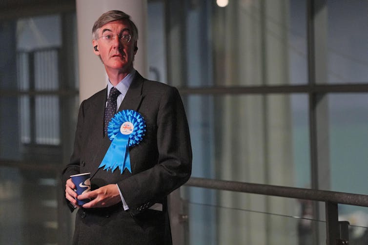 Rees-Mogg with big blue rosette