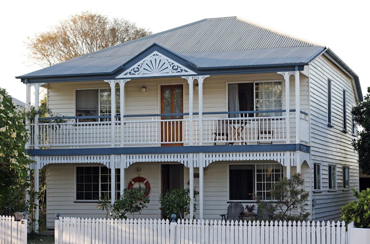 Renovated blue and white Queenslander house in the northern suburb of Brisbane