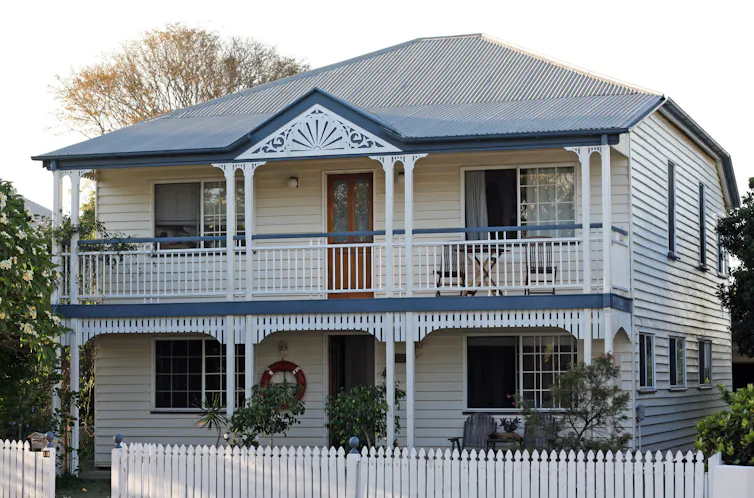 Renovated blue and white Queenslander house in the northern suburb of Brisbane