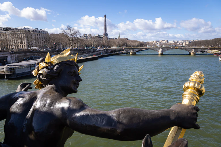 statue over seine river