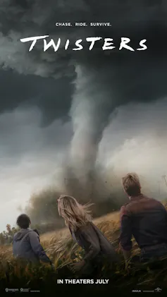 three people watch tornado in black sky