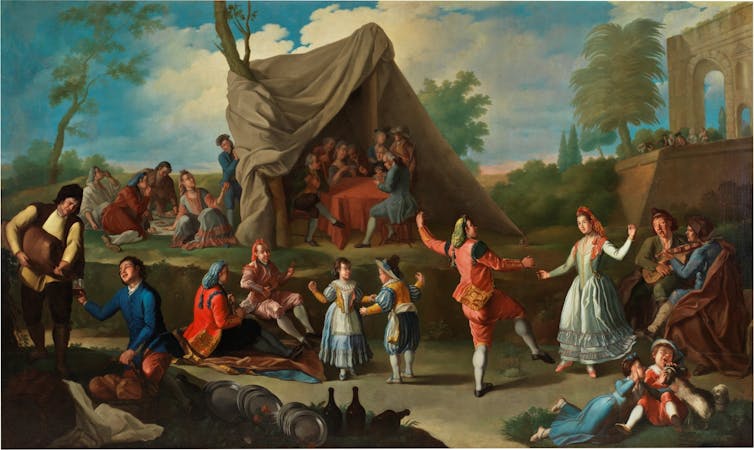 Un grupo de personas baila en una escena campestre.