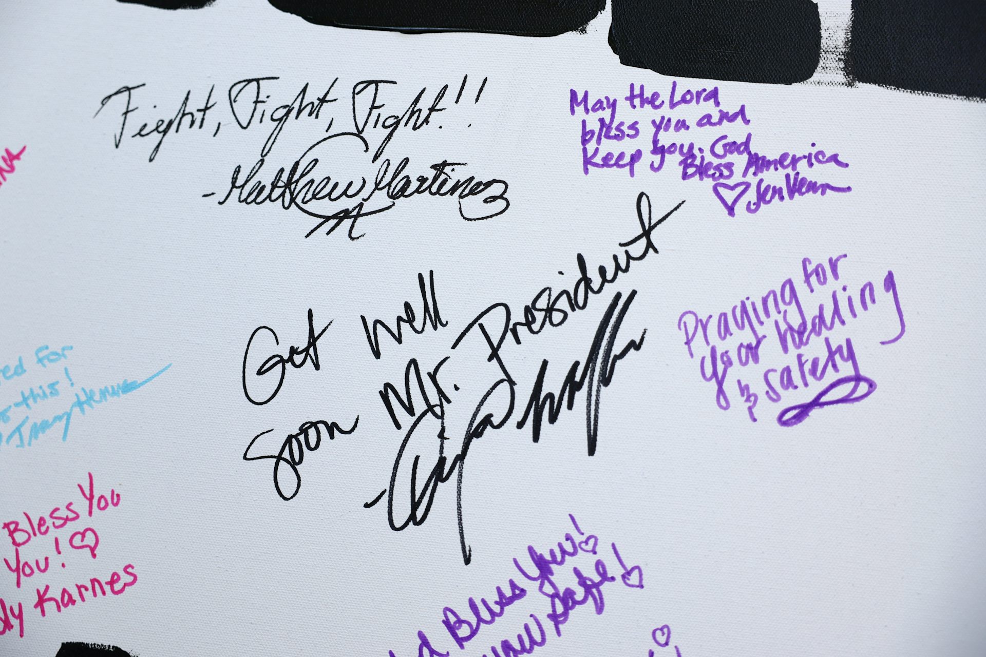 A card with messages of support for Donald Trump.