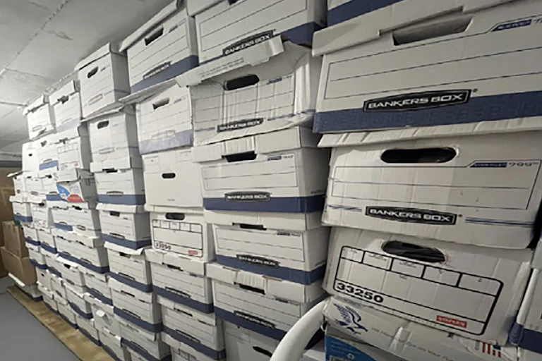 Dozens of boxes that allegedlycontain classified documents are stacked in a storage room at Donald Trump's estate.