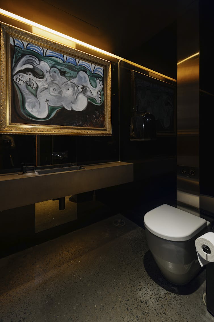 A painting and a toilet.