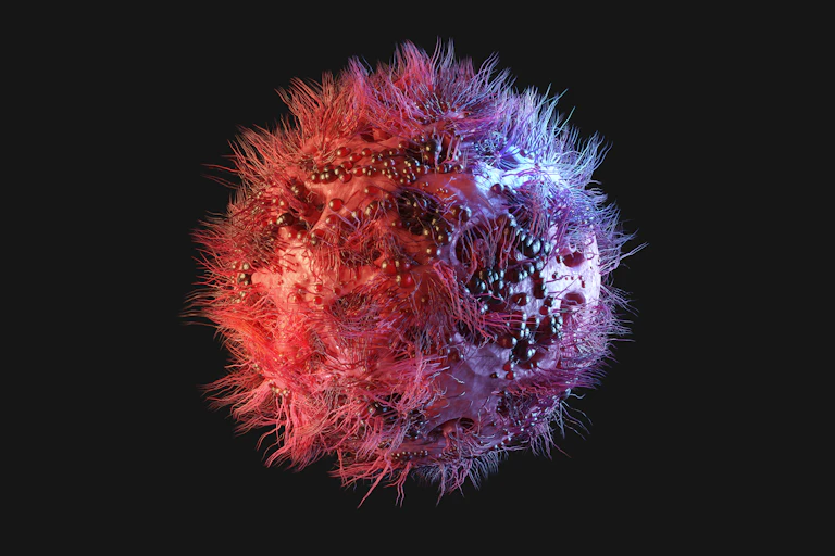 Pinkish sphere with a hairy appearance and small nodules and pits on its surface