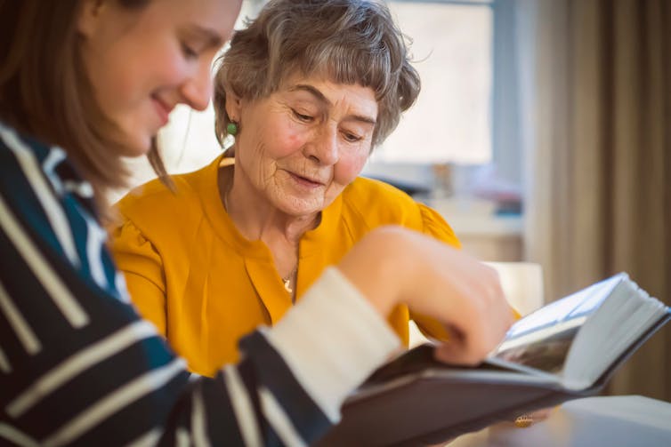 Woman shows her grandmother photos