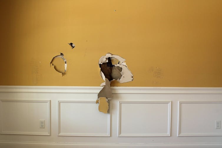 A hole has been punched into a wall.
