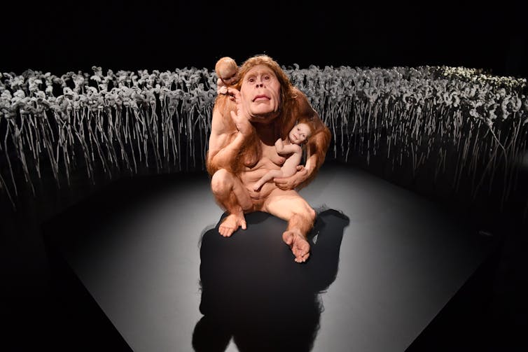 A human/animal hybrid, with young children.