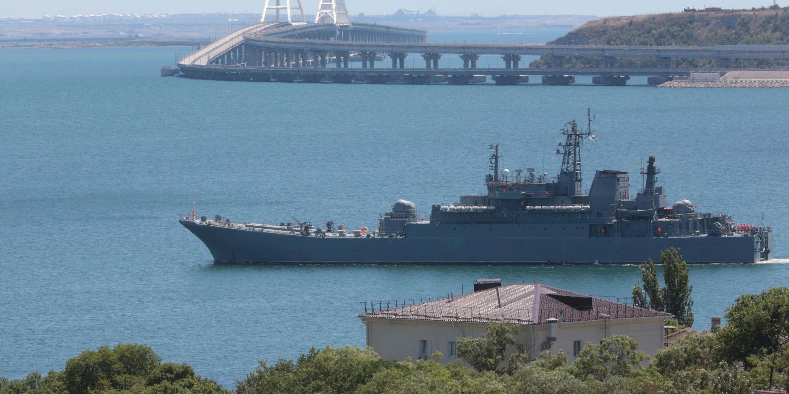 A Russian warship with the Kerch Bridge in the background, July 2023.