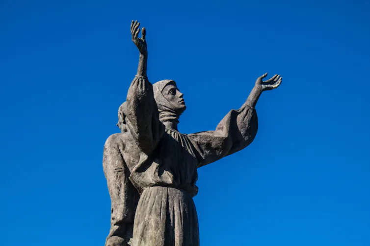 A statue of a man, a woman and two children commemorating Ukraine's 1930s famine.