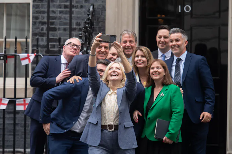 People taking group selfie