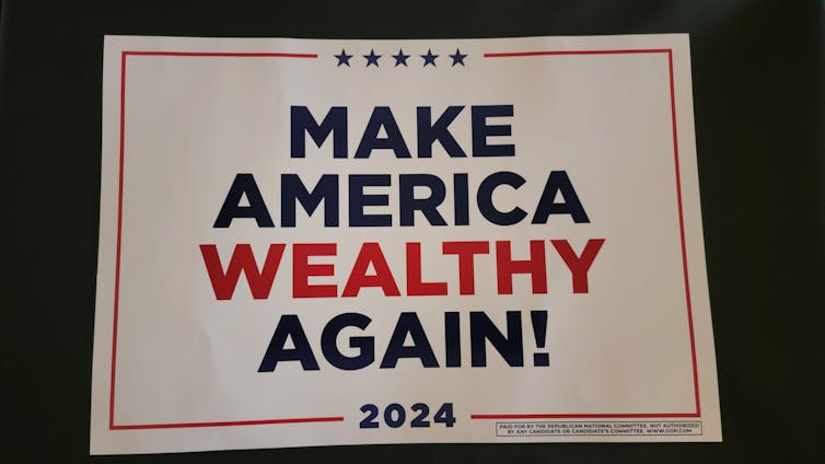 A red, white and blue sign that says 'MAKE AMERICA WEALTHY AGAIN! 2024'