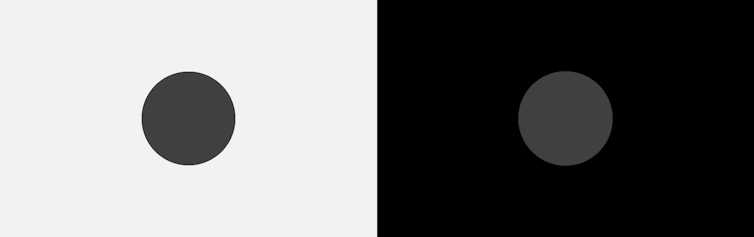A black circle on a white background next to a gray circle on a black background