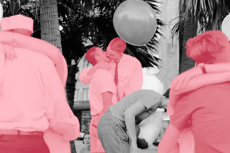 Black, white and pink photograph of activists kissing