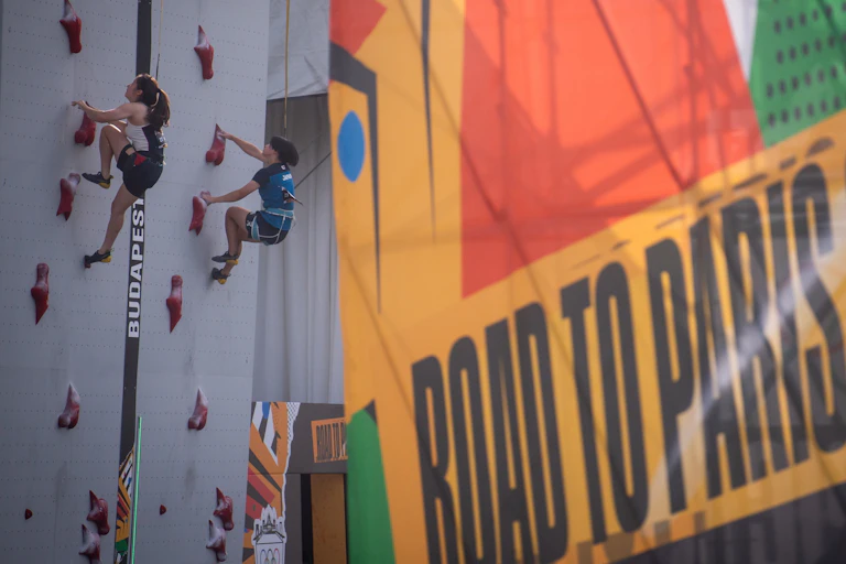 Competitors climb during the sport climbing Olympic qualifier series in Budapest