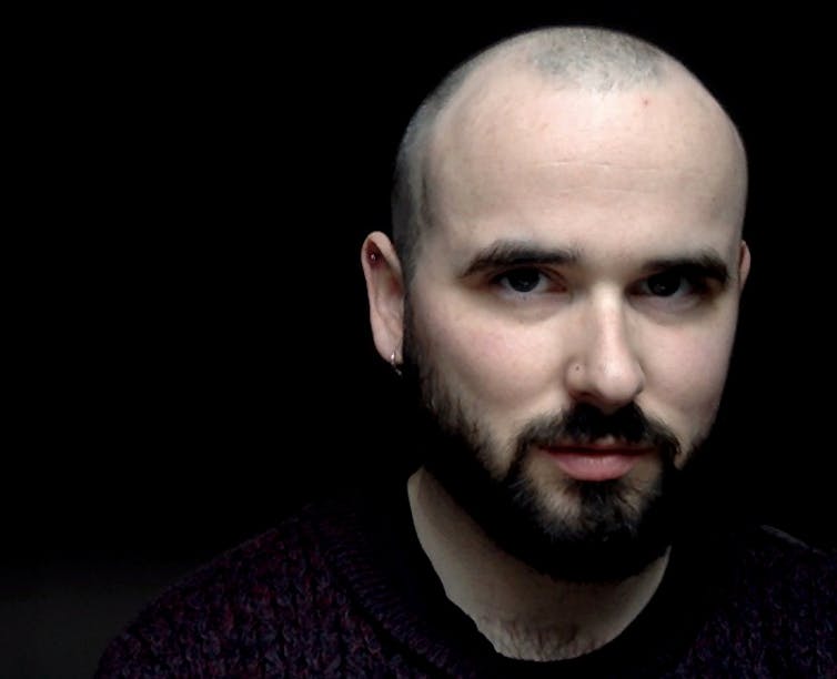 Michael Magee on a black backdrop