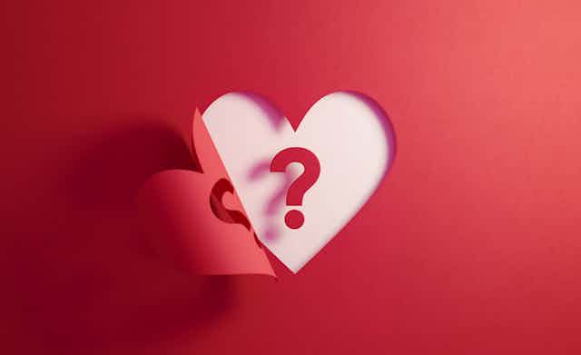 Illustration of cutout of heart from red paper with <a href=