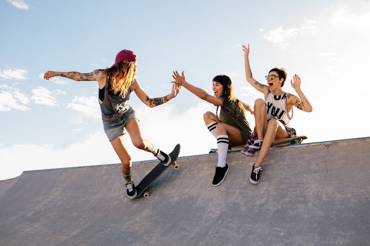 Group of women skateboarding