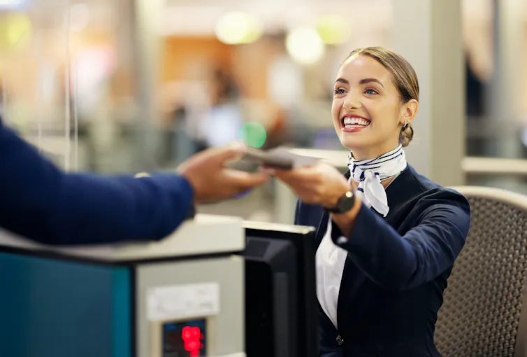 Smilng airline employee.