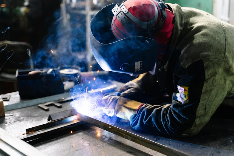 A person welding.