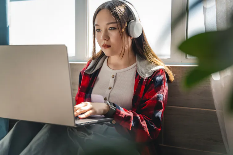 Girl writing on laptop