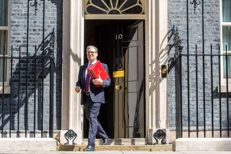 Keir Starmer walking out of 10 Downing street.