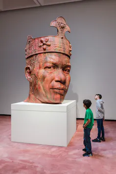 Huge statue of man's head with crown