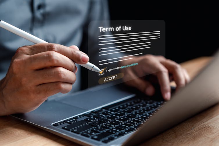 Graphic showing 'terms of use' floating above a laptop screen