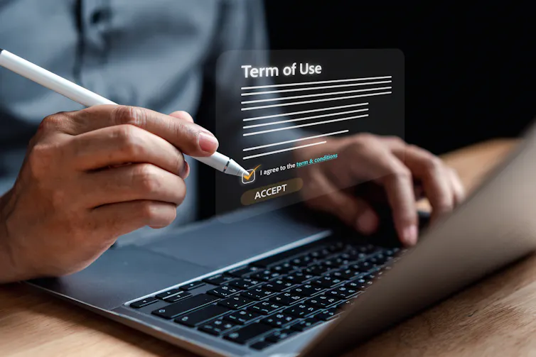 Graphic showing 'terms of use' floating above a laptop screen