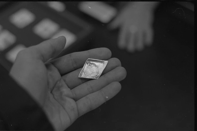 Hand holding a coin