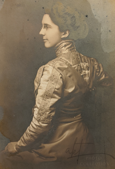 Sepia portrait of side profile of a woman in a dress