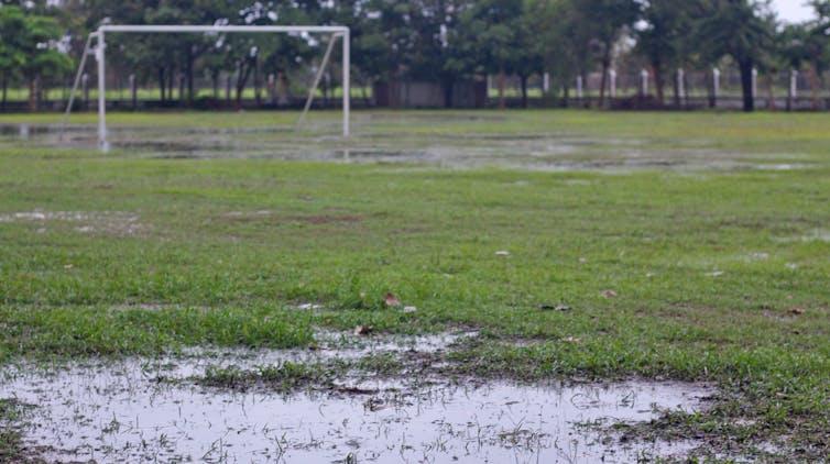 A waterlogged field stands deserted.