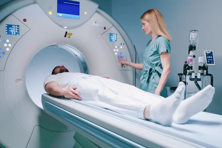 A man about to enter an MRI machine