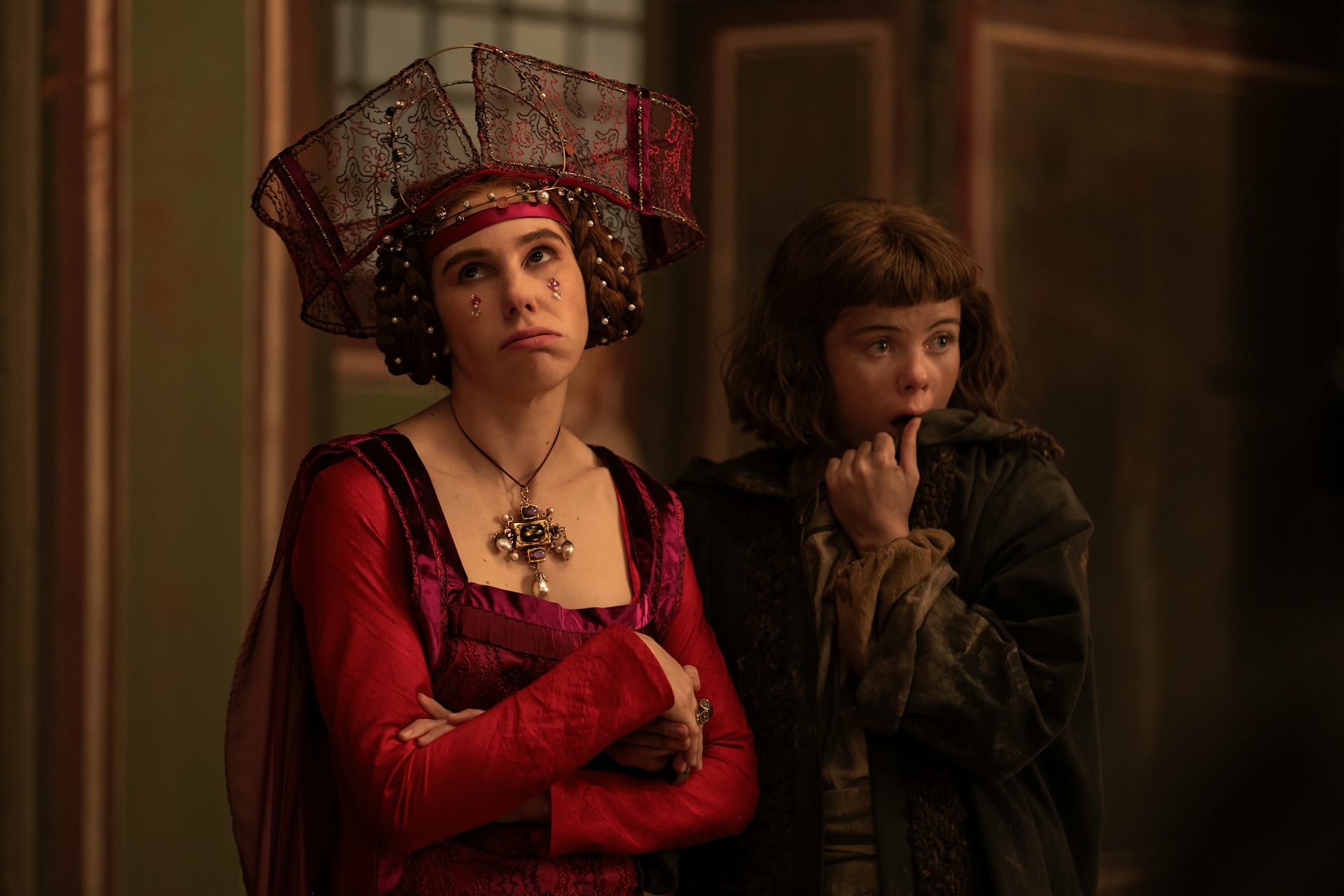 A medieval woman in finery rolling her eyes.