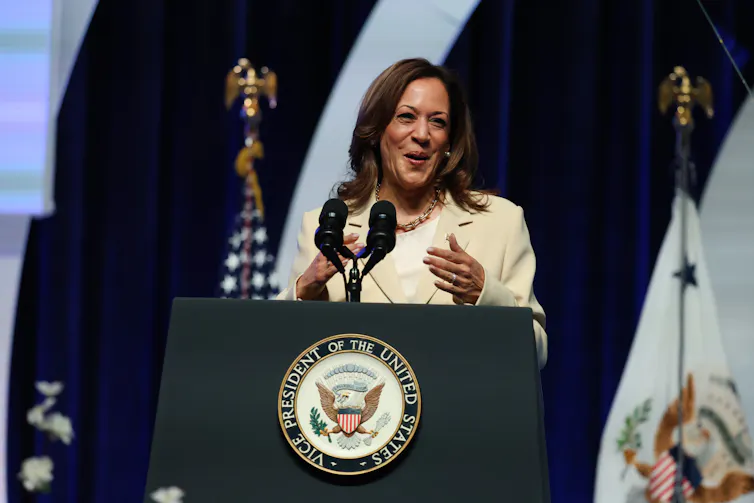 US vice-president Kamala Harris stands at a podium speaking to a rally ikn Indianapolis.