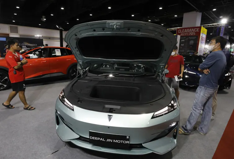 An electric car being shown at a Chinese expo.