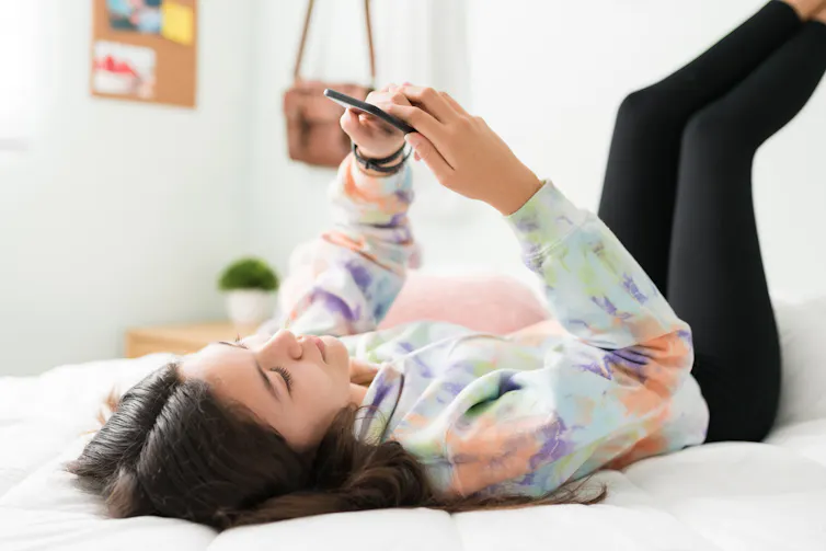 A teen girl on a smartphone