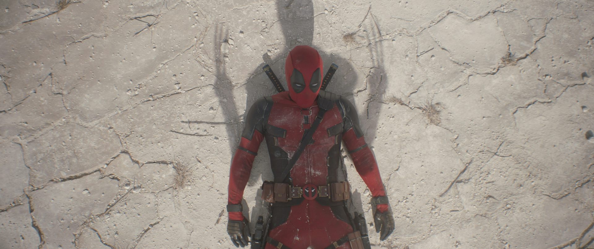 Deadpool lying in Wolverine's shadow.