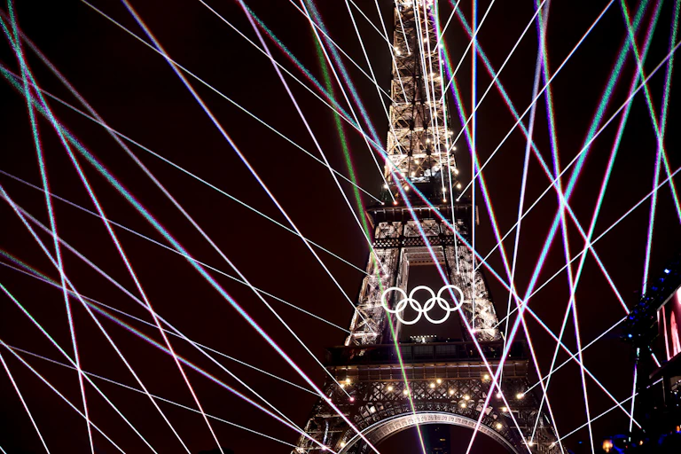 A light show illuminates the Eiffel Tower