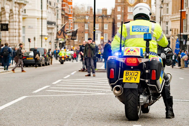 View from behind a Met police officer on a motorbike in central London